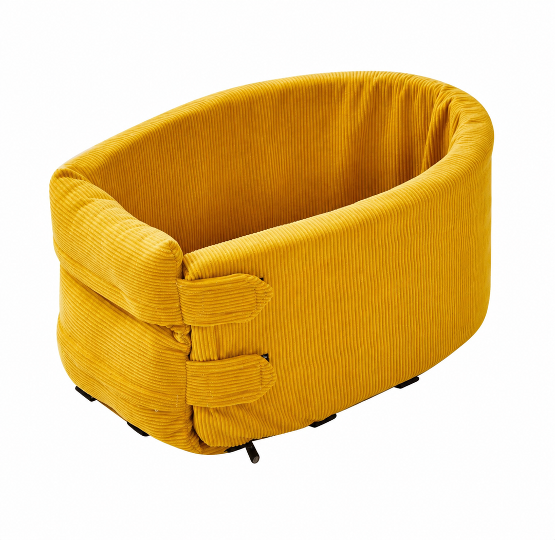 The mustard corduroy travel bed on a plain background, seen from above