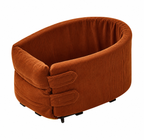 The rust corduroy travel bed on a plain background, seen from the side