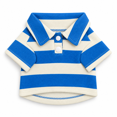 A blue and cream striped dog polo shirt laid flat, with a collar and two press-stud buttons