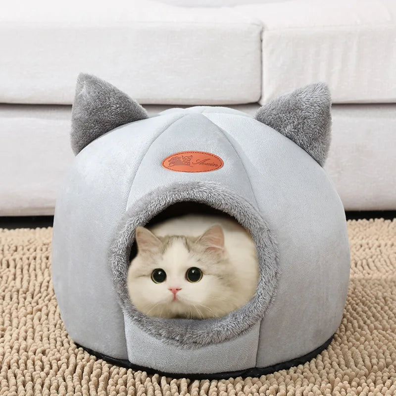 Cat relaxing inside a soft gray cat cave house featuring an enclosed design, plush lining, and cute cat-ear details. Warm indoor pet bed that provides security, comfort, and a private sleeping space for cats and kittens. | Pet Grooming | Pet Supplies and Food Australia | Pet Supplies Sydney | PetNexa Australia | Shop now