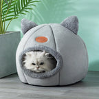 White cat resting inside a gray cat cave bed with plush cat-ear accents and a soft enclosed design, creating a warm, secure hideaway for cats and kittens. | Pet Grooming | Pet Supplies and Food Australia | Pet Supplies Sydney | PetNexa Australia | Shop now