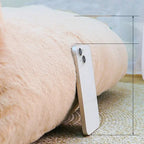 Close-up of the plush pet sofa bed showing its thick cushioned base and elevated design, with a smartphone placed beside it to demonstrate mattress height and support. | Pet Grooming | Pet Supplies and Food Australia | Pet Supplies Sydney | PetNexa Australia | Shop now