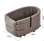 The grey corduroy travel bed with measurement lines: 44 cm long, 29 cm wide, 22 cm high and 23 cm deep inside